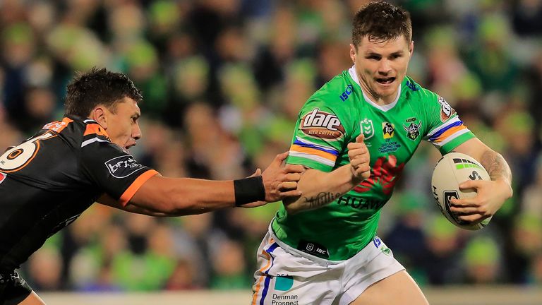 John Bateman of the Raiders is tackled by Elijah Taylor of the Tigers during the round 18 NRL match between the Canberra Raiders and the Wests Tigers at GIO Stadium on July 20, 2019 in Canberra, Australia.