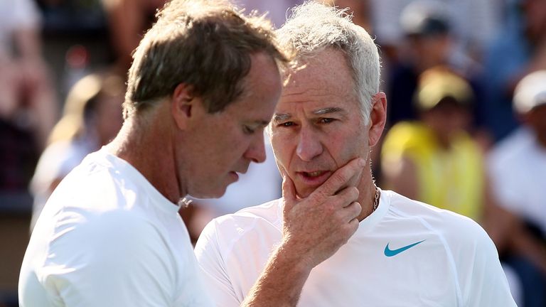 John McEnroe of the United States talks tactics with his partner Patrick McEnroe of the United States during their men's champions doubles match against Cedric Pioline of France and Mats Wilander of Sweden on Day Eleven of the 2013 US Open at USTA Billie Jean King National Tennis Center on September 5, 2013 in the Flushing neighborhood of the Queens borough of New York City.