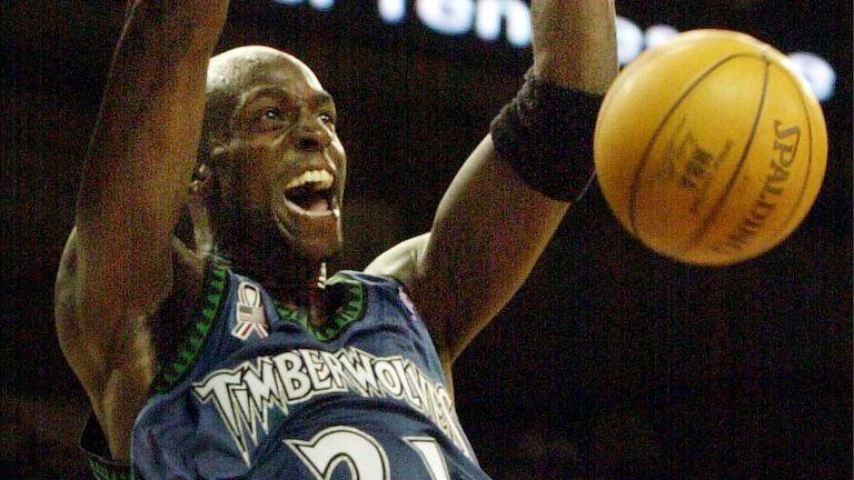 Kevin Garnett throws down a two-handed  slam for the Minnesota Timberwolves