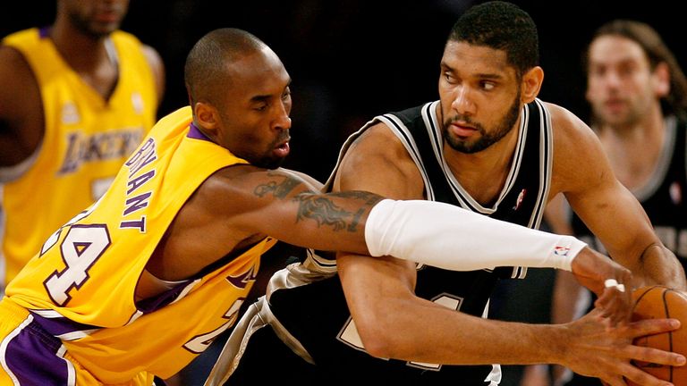 Tim Duncan protects the ball from Kobe Bryant during a Lakers-Spurs clash