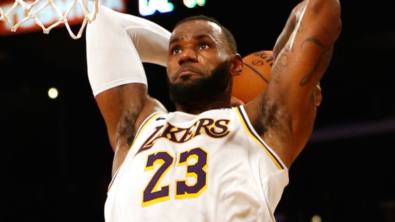 LeBron James throws down a two-handed dunk for the Lakers