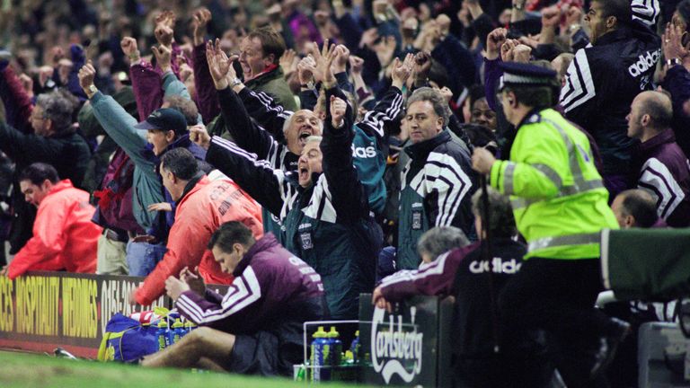 Liverpool's bench celebrate the winner as Kevin Keegan slumps on the advertising board