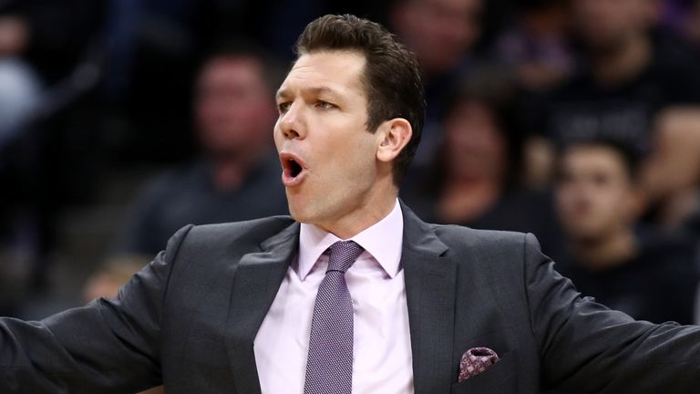 Head coach Luke Walton is animated on the sideline during a Kings game