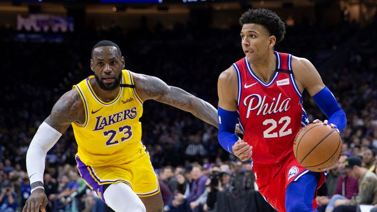 Matisse Thybulle #22 of the Philadelphia 76ers dribbles the ball past LeBron James #23 of the Los Angeles Lakers