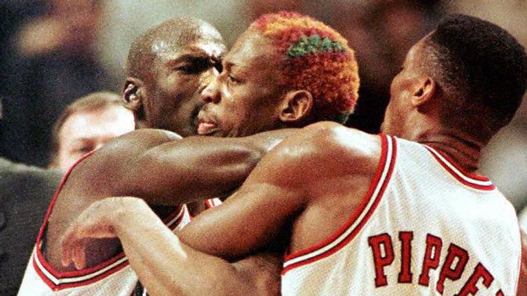 Michael Jordan and Scottie Pippen restrain Dennis Rodman