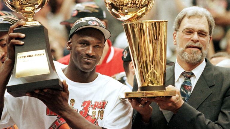 Michael Jordan and Phil Jackson celebrate the Chicago Bulls 1998 NBA championship victory
