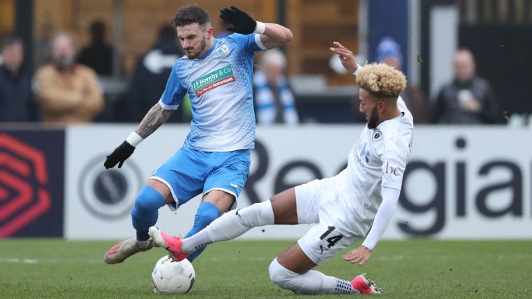 Boreham Wood's Sorba Thomas and Brad Barry of Barrow in National League action in January
