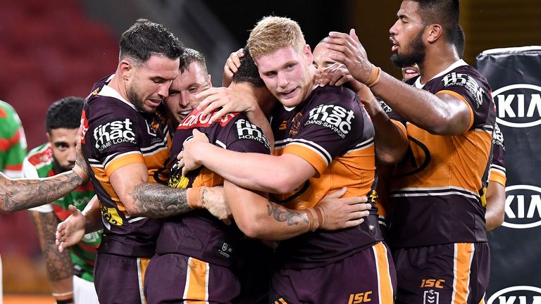 BRISBANE, AUSTRALIA - MARCH 20: Kotoni Staggs of the Broncos is congratulated by team mates after scoring a try during the round 2 NRL match between the Brisbane Broncos and the South Sydney Rabbitohs at Suncorp Stadium on March 20, 2020 in Brisbane, Australia. (Photo by Bradley Kanaris/Getty Images)