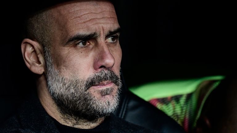Manchester City manager Pep Guardiola on the bench at the Santiago Bernabeu