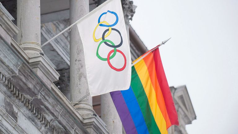 The rainbow flag flies over city hall alongside the Olympic flag in Montreal, Friday, February 7, 2014, for the duration of the Winter Olympic Games in Sochi. THE CANADIAN PRESS/Graham Hughes