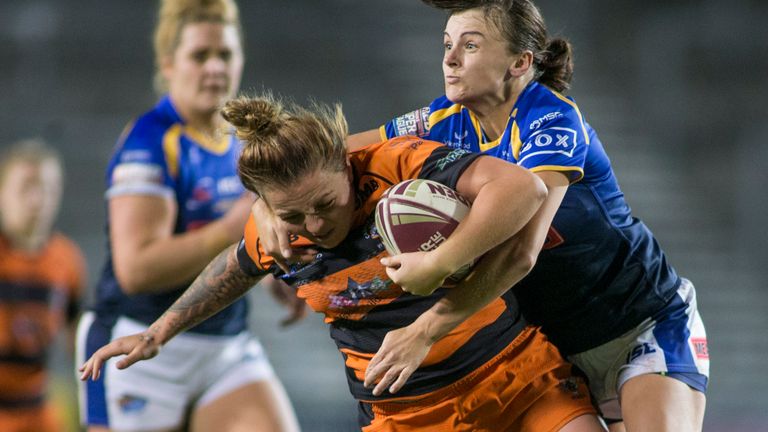 Picture by Isabel Pearce/SWpix.com - 11/10/2019 - Rugby League - Women's Super League Grand Final - Castleford Tigers v Leeds Rhinos - The Totally Wicked Stadium, Langtree Park, St Helens, England - Rhiannion Marshall of Castleford is tackled by Charlotte Booth and Hannah Butcher of Leeds.