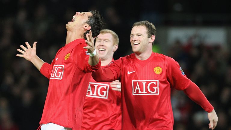MANCHESTER, ENGLAND - JANUARY 30:  Cristiano Ronaldo od Manchester United celebrates scoring their second goal during the Barclays FA Premier League match between Manchester United and Portsmouth at Old Trafford on January 30 2008 in Manchester, England. (Photo by John Peters/Manchester United via Getty Images) *** Local Caption *** Cristiano Ronaldo;Paul Scholes;Wayne Rooney