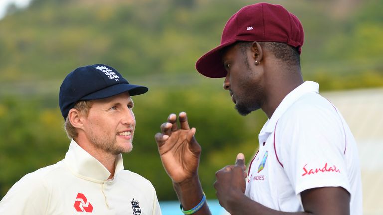 England Test captain Joe Root talks with West Indies skipper Jason Holder during the series in the Caribbean in 2019