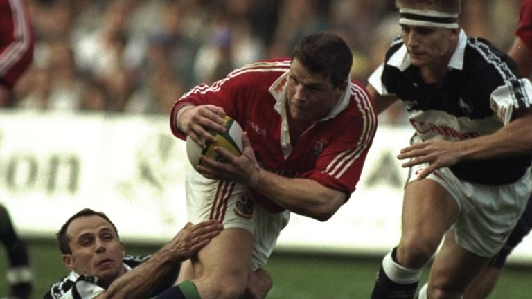 14 Jun 1997: Scott Gibbs of the British Lions (centre) is tackled during the match against Natal Sharks at Kings Park in Durban, Natal, South Africa. The British Lions won the match 14-42. \ Mandatory Credit: David Rogers /Allsport