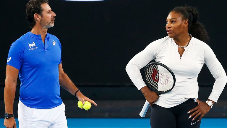 Serena Williams of the United States (R) speaks with coach Patrick Mouratoglou during practice ahead of the 2020 Australian Open