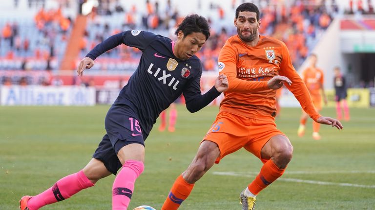 Marouane Fellaini in action for Shandong Luneng against Kashima Antlers 