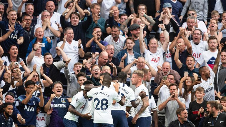 Spurs fans and players celebrate as Harry Kane scores their second goal against Villa in August 2019