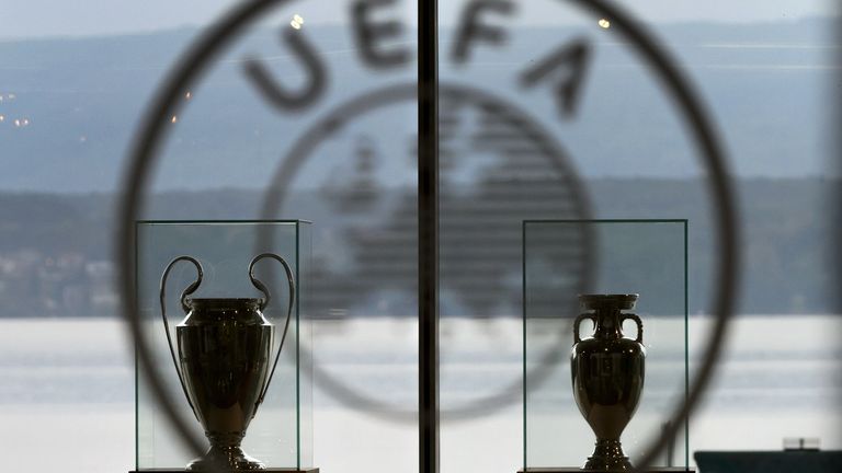 Champions League and European Cup trophies are seen at UEFA headquarters in Nyon, Switzerland