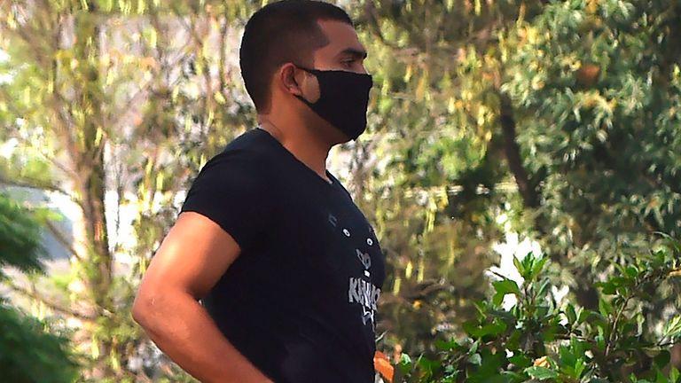 Pakistani cricketer Umar Akmal wearing a facemask leaves after appearing before a disciplinary committee in Lahore on April 27, 2020. - Pakistan's controversial batsman Umar Akmal has been banned from all forms of cricket for three years after he pleaded guilty to failing to report fixing approaches, a disciplinary committee announced on April 27