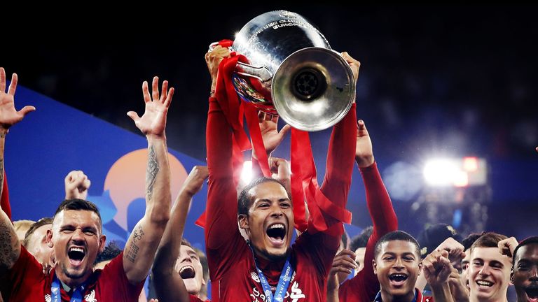 Van Dijk celebrates lifting the Champions League trophy after victory in the 2019 final against Tottenham