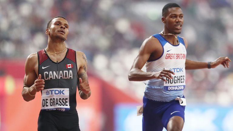 Andre De Grasse of Canada and Zharnel Hughes of Great Britain compete in Doha 
