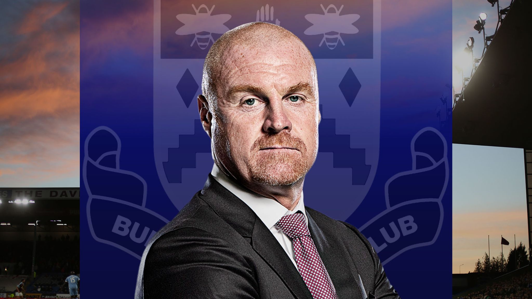  Burnley manager Sean Dyche is seen in front of a blue background with a crest on the left and a floodlit stadium on the right.