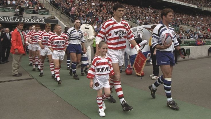 25 May 1996: Bath and Wigan teams walking out with Wigan's mascot before the Rugby Union match of the clash of the codes, Rugby Union and League, held at Twickenham, London. Bath won 44-19. \ Mandatory Credit: Mike Hewitt/Allsport