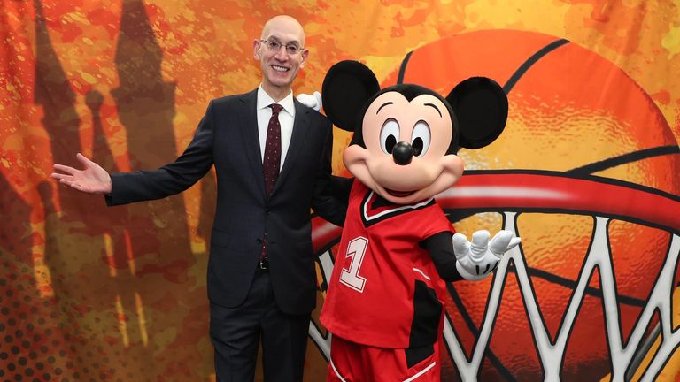 NBA commissioner Adam Silver poses with Mickey Mouse - credit NBA.com