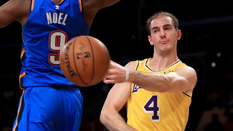 Alex Caruso whips an airborne pass to a Lakers team-mate
