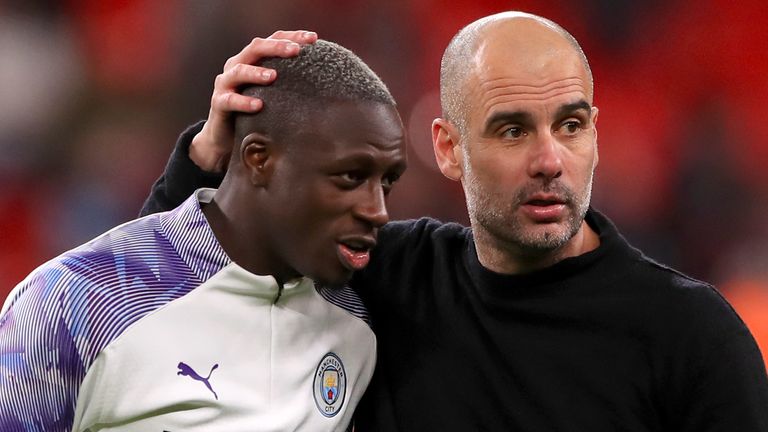 Benjamin Mendy celebrates with Pep Guardiola after the 2-1 Carabao Cup Final win over Aston Villa