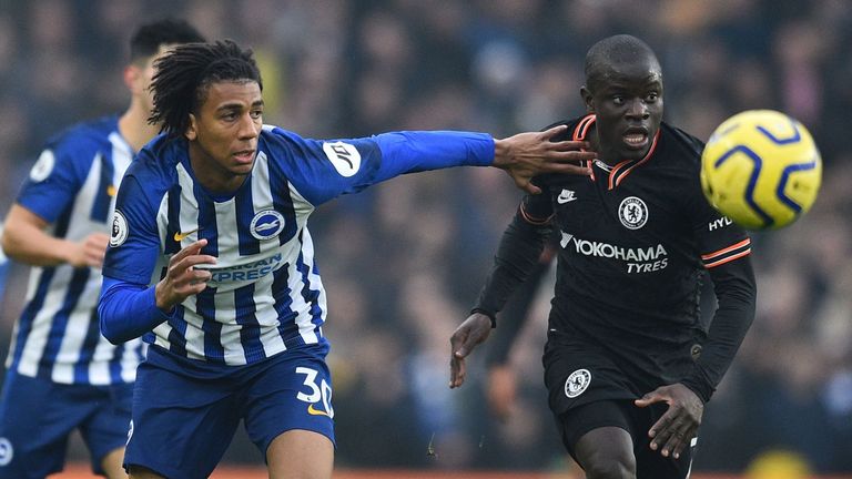 Brighton's Brazilian midfielder Bernardo (L) vies with Chelsea's French midfielder N'Golo Kante