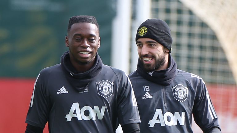 Aaron Wan-Bissaka and Bruno Fernandes of Manchester United in action during a first team training session at Aon Training Complex on March 11, 2020