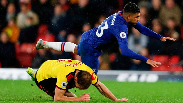 Watford's Craig Dawson tackles Chelsea's Emerson Palmieri at Vicarage Road