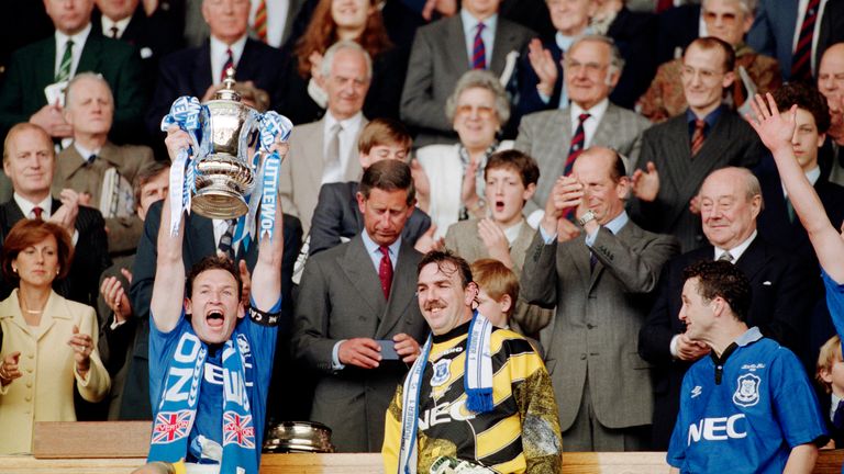 Everton captain Dave Watson holds aloft the FA Cup alongside Neville Southall