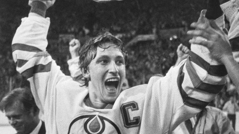 Edmonton Oilers team captain Wayne Gretzky lifts the Stanley Cup high over his head after the Oilers beat the New York Islanders, 5-2, to win the 1984 Stanley Cup series.