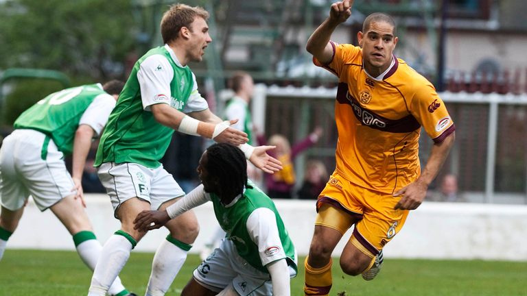 Giles Coke (right) wheels away after pulling Motherwell level