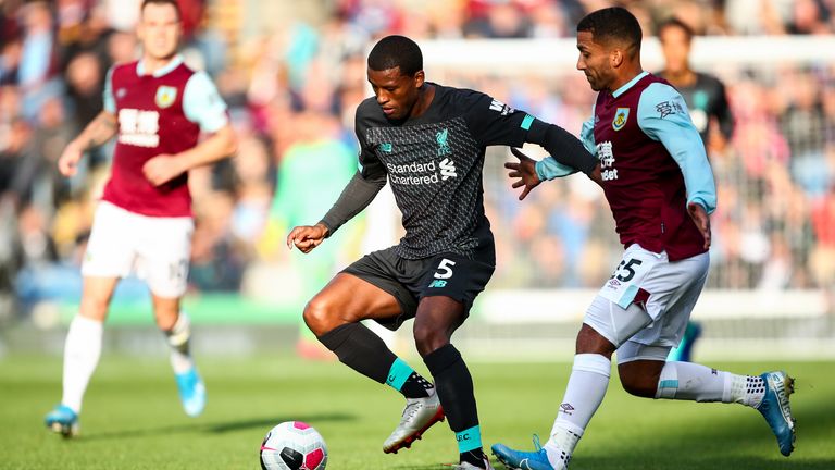 Liverpool's Gini Wijnaldum holds off Burnley's Aaron Lennon at Turf Moor in August 2019