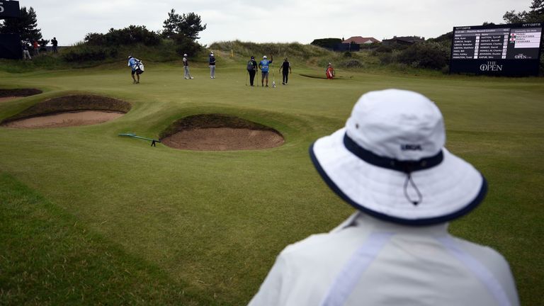 A view of play on the 5th green during a practice round at Royal Birkdale golf course near Southport in north west England on July 19, 2017, ahead of the 146th Open Golf Championship. / AFP PHOTO / Oli SCARFF / RESTRICTED TO EDITORIAL USE (Photo credit should read OLI SCARFF/AFP via Getty Images)