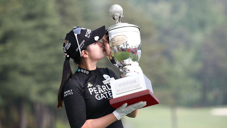 Park Hyun-kyung kissing the KLPGA Championship trophy after her victory