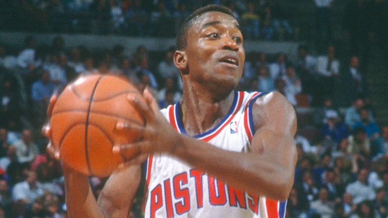 Isiah Thomas looks to pass to a Pistons team-mate