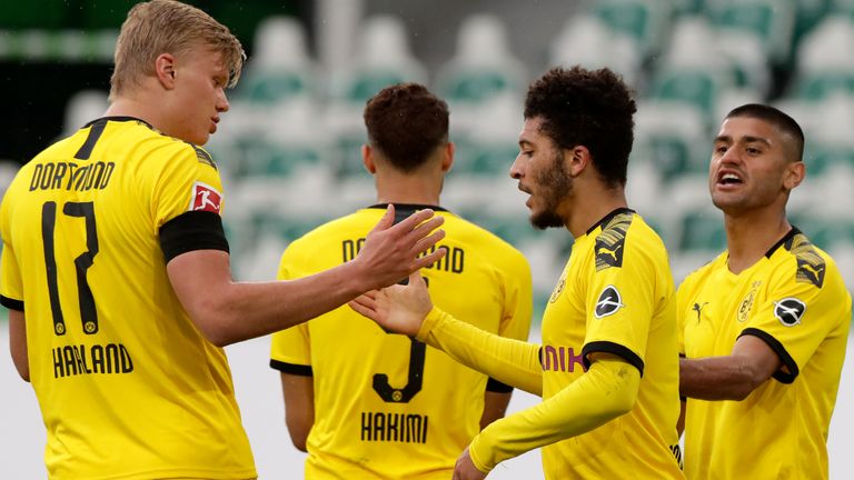 Borussia Dortmund players celebrate Achraf Hakimi's goal, with Jadon Sancho providing the assist