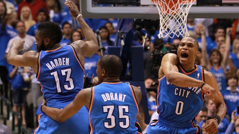 James Harden, Kevin Durant and Russell Westbrook of the Oklahoma City Thunder celebrate after scoring with 10 seconds against the Dallas Mavericks during Game Four of the Western Conference Quarterfinals in the 2012 NBA Playoffs