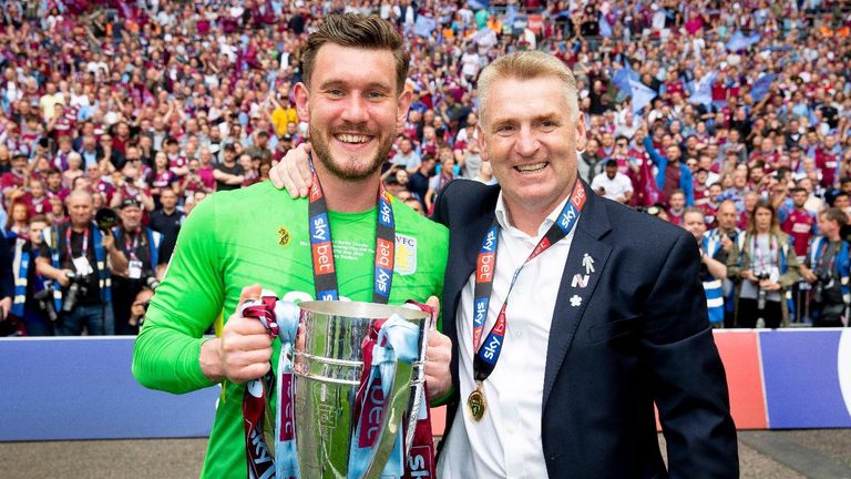 Aston Villa goalkeeper Jed Steer and head coach Dean Smith celebrate promotion to the Premier League