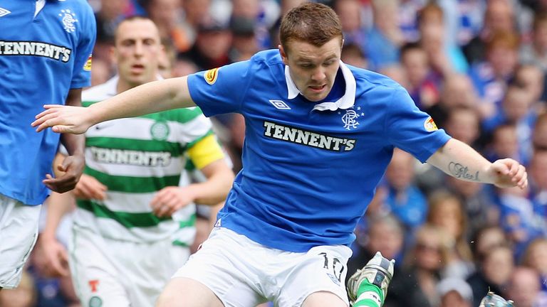 John Fleck battles for the ball during an Old Firm clash in 2011