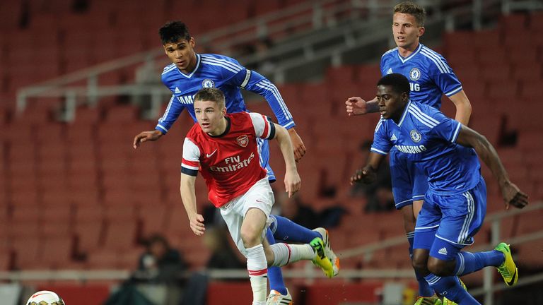 Daniel Crowley of Arsenal takes on Ruben Loftus-Cheek, Jordan Houghton and Isak Ssewankambo of Chelsea 