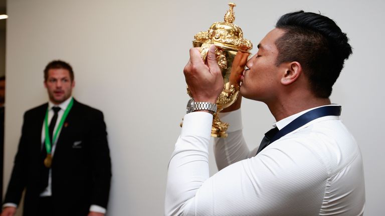 Julian Savea of the All Blacks kisses the Webb Ellis Cup as Richie McCaw looks on following the 2015 Rugby World Cup Final match between New Zealand and Australia at Twickenham Stadium on October 31, 2015 in London, United Kingdom.