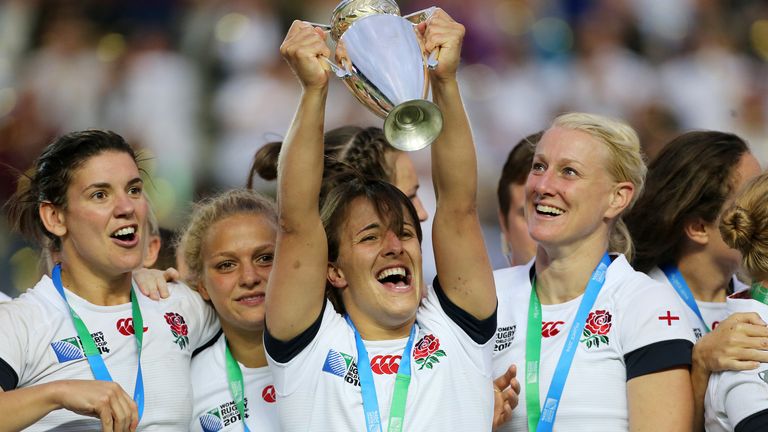Daley-Mclean lifts the 2014 Women's Rugby World Cup trophy