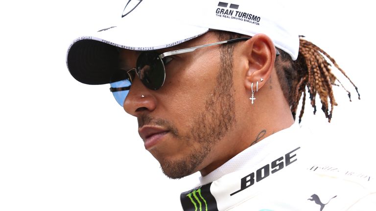 Lewis Hamilton feels as though he 'stands alone' in a 'white-dominated' sport