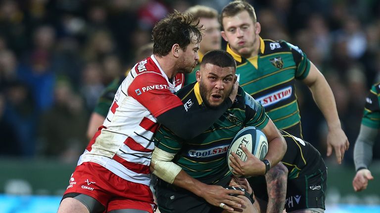 Lewis Ludlam of Northampton Saints is tackled by Danny Cipriani of Gloucester
