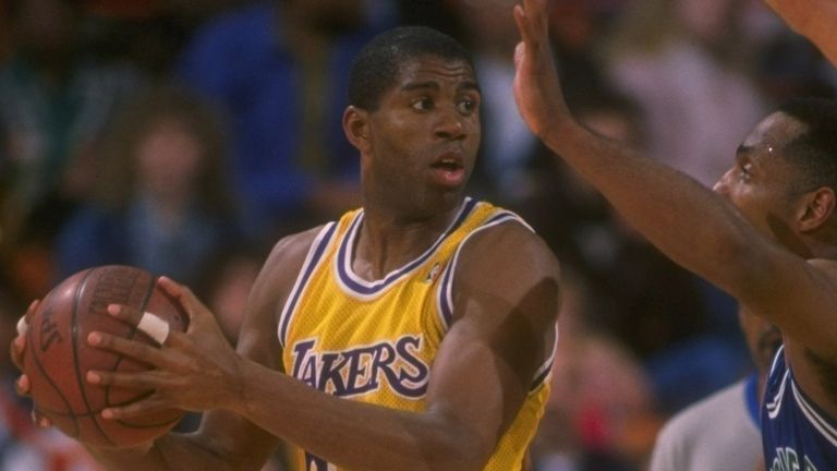 Earvin Magic Johnson of the Los Angeles Lakers passes the ball up